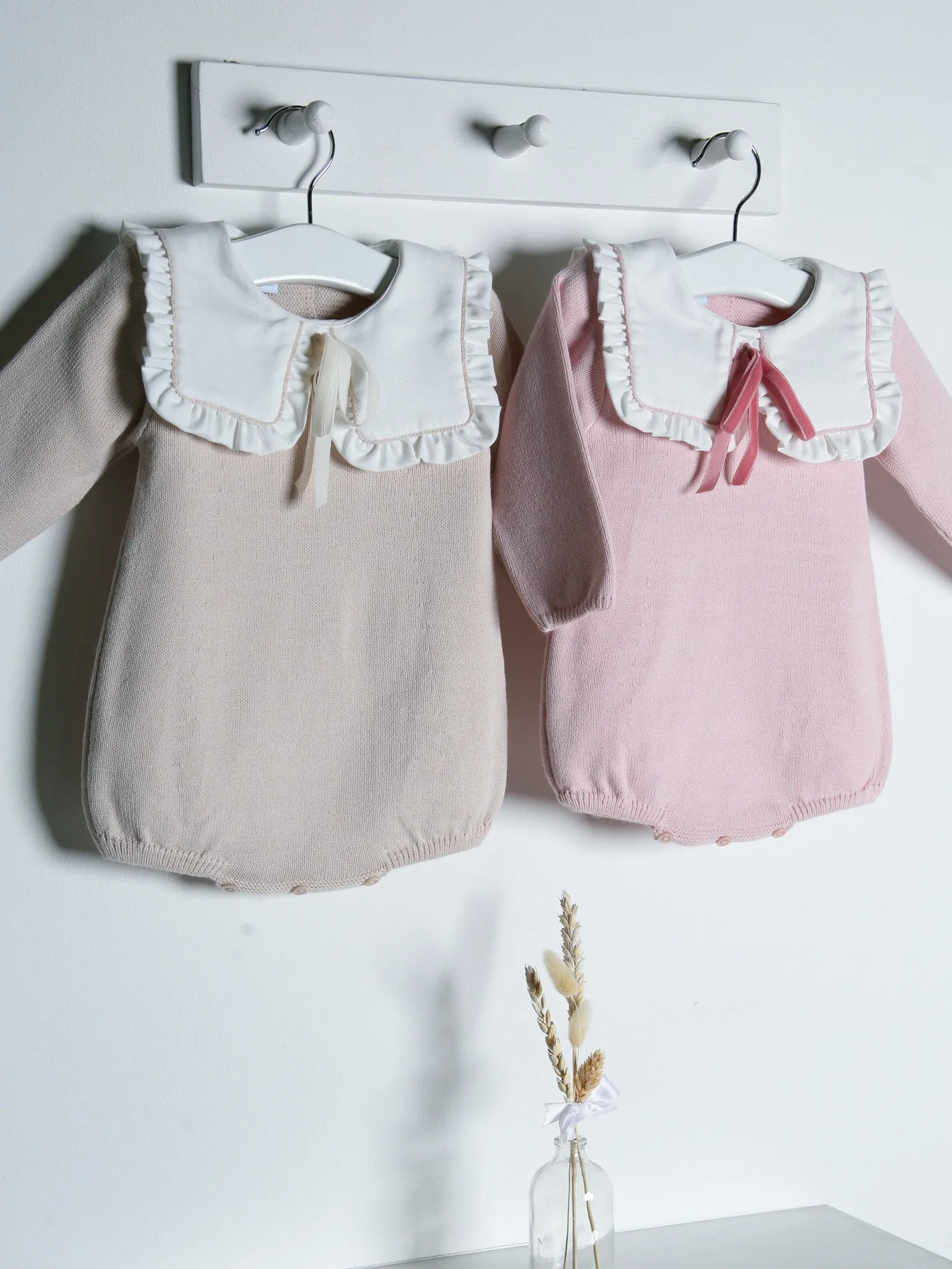 Baby Etta Pink knitted romper with bib collar