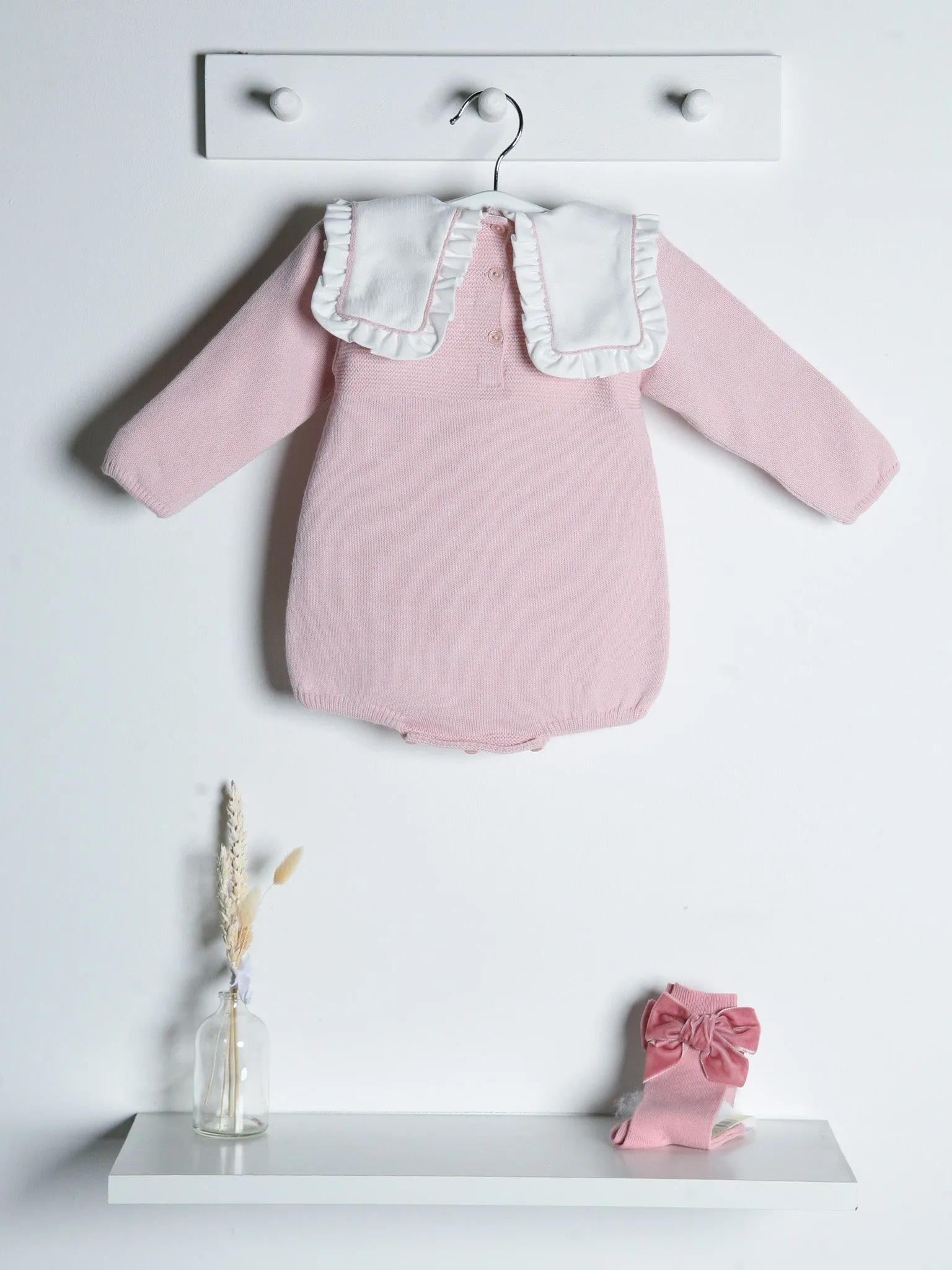 Baby Etta Pink knitted romper with bib collar
