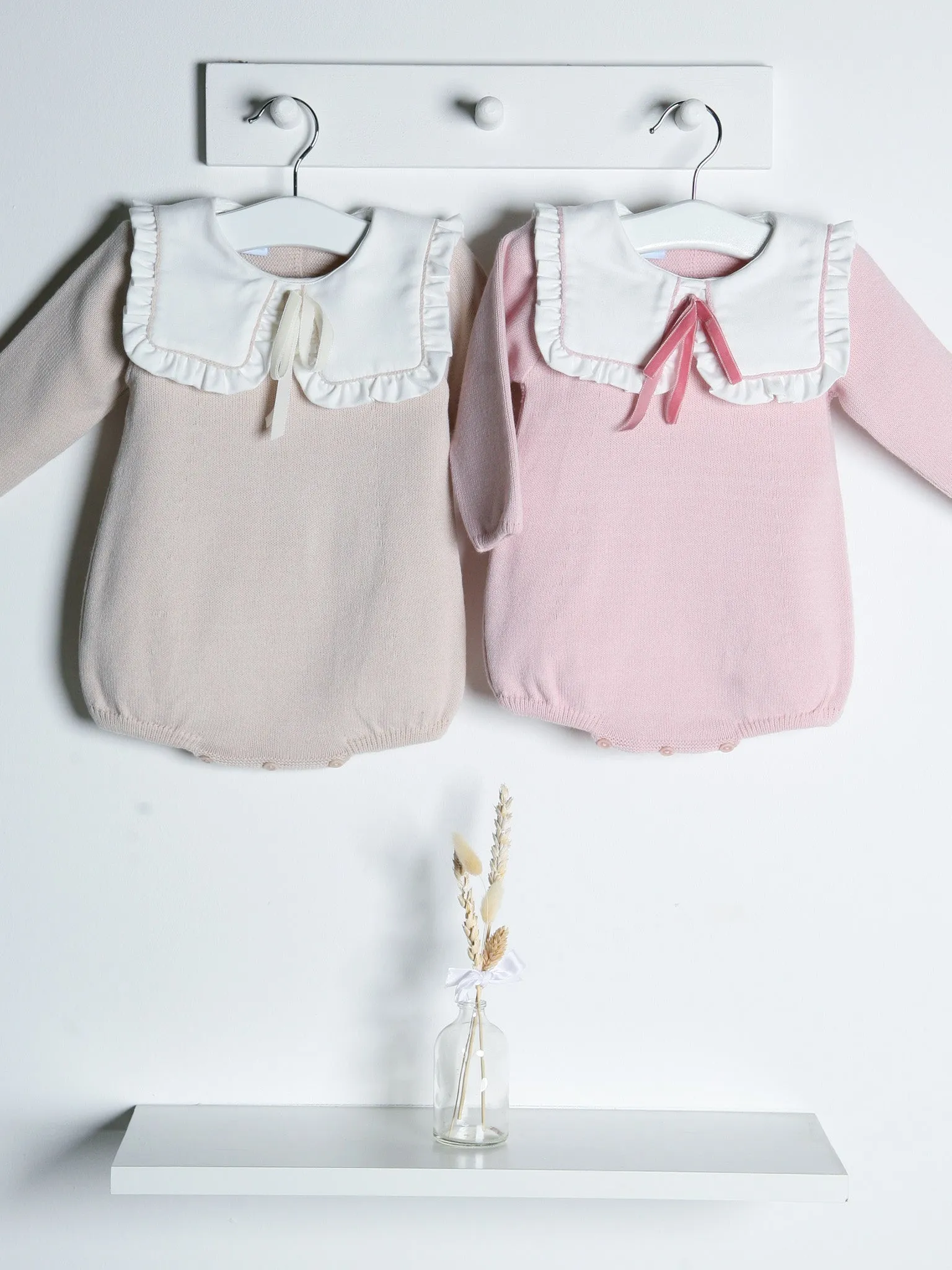 Baby Etta Pink knitted romper with bib collar