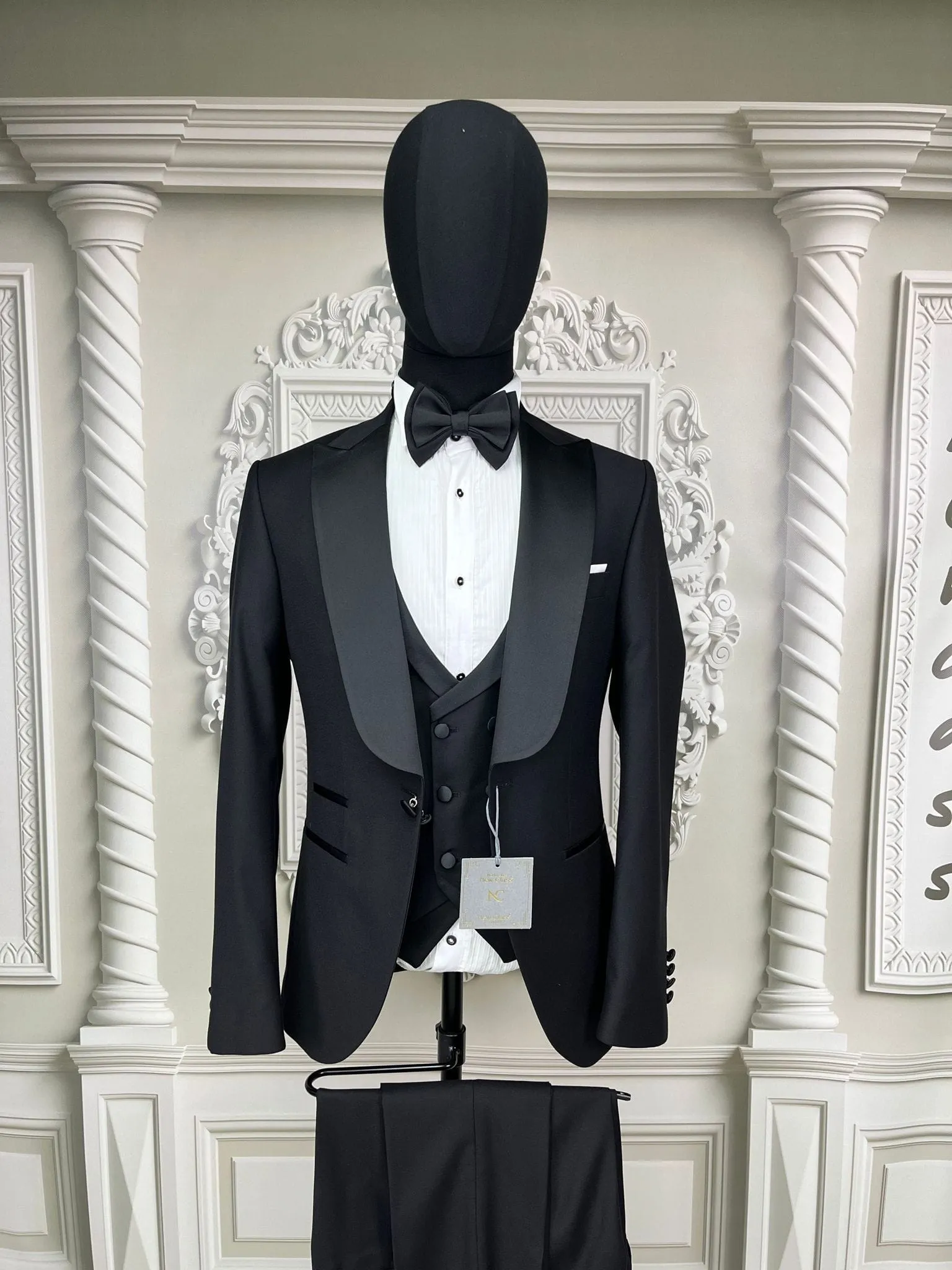 Single Button Three Pieces Tuxedo Suit with contrasting green velvet Lapel, matching bow tie and Black Pants.
