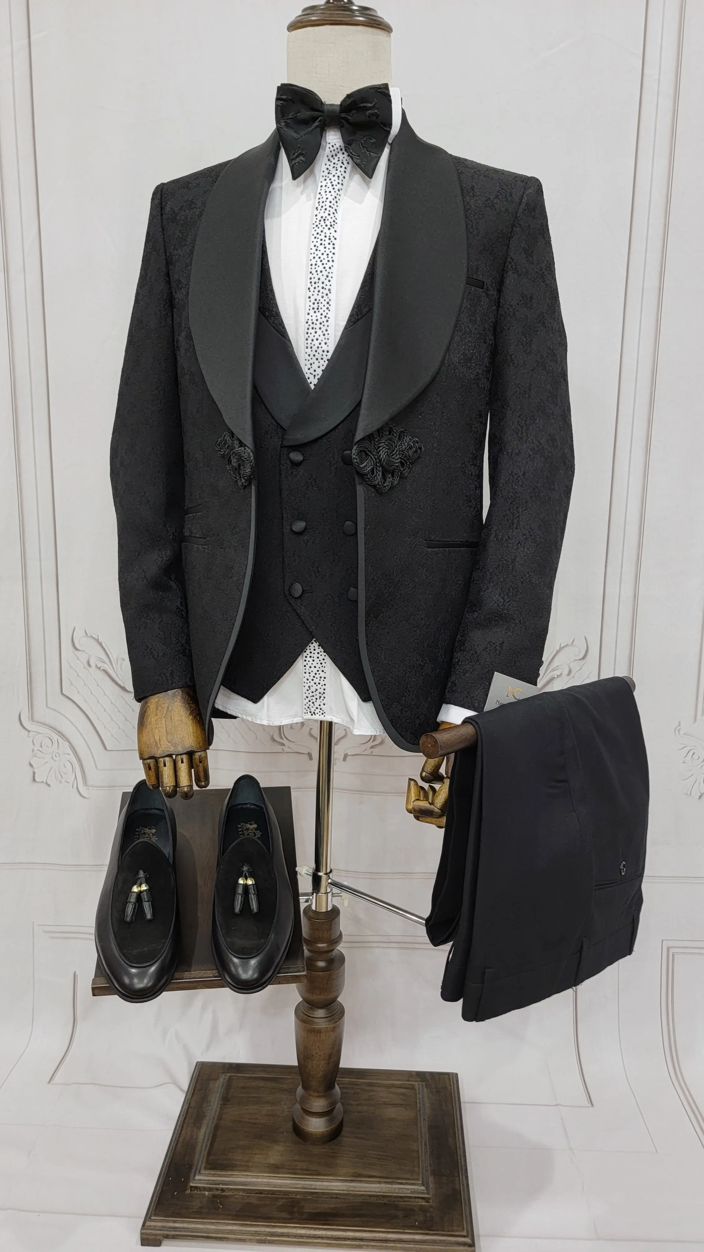 Three Piece Tuxedo Suit with Contrasting Black Satin Lapel, matching bow tie and Black Pants.