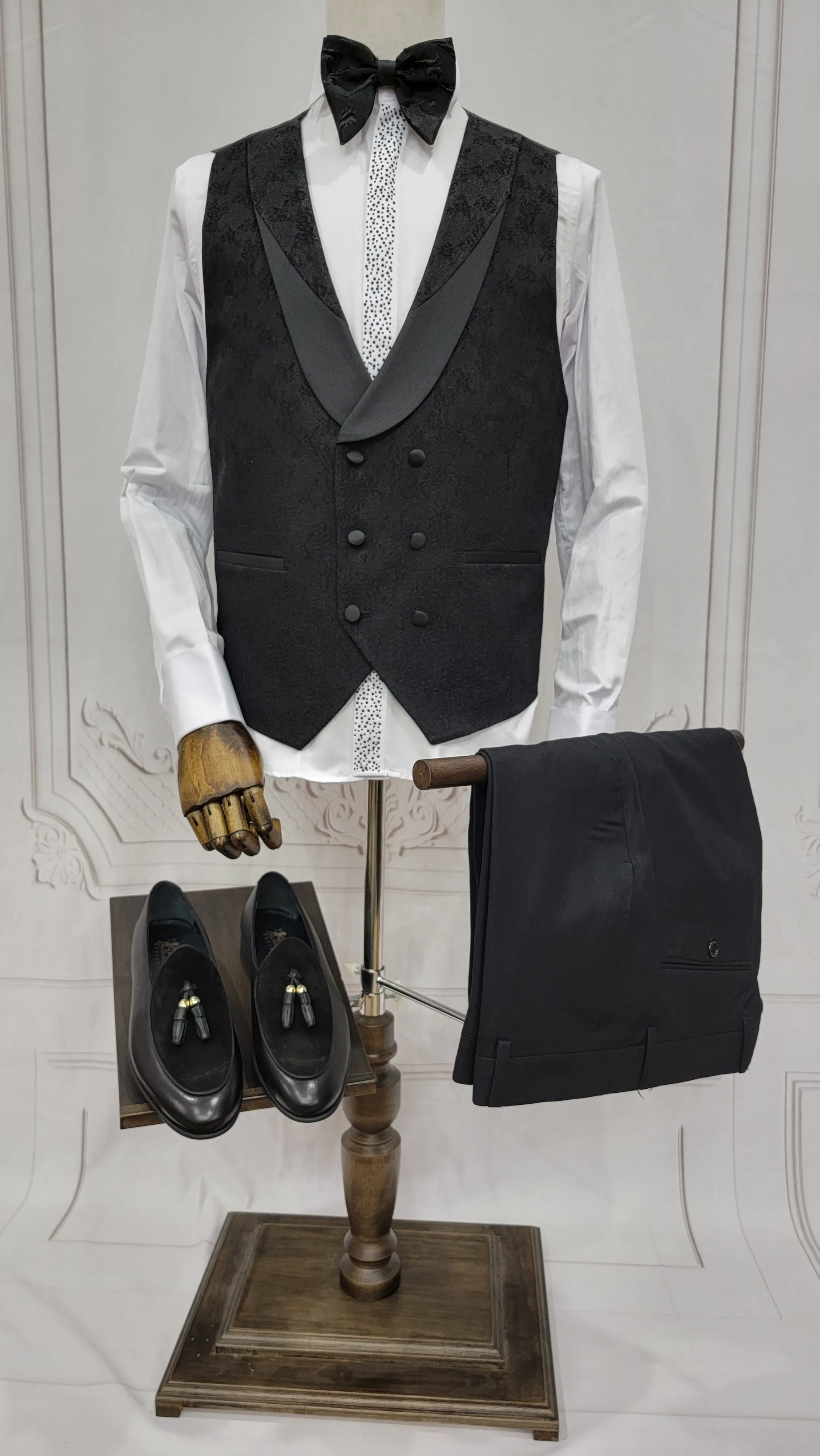 Three Piece Tuxedo Suit with Contrasting Black Satin Lapel, matching bow tie and Black Pants.